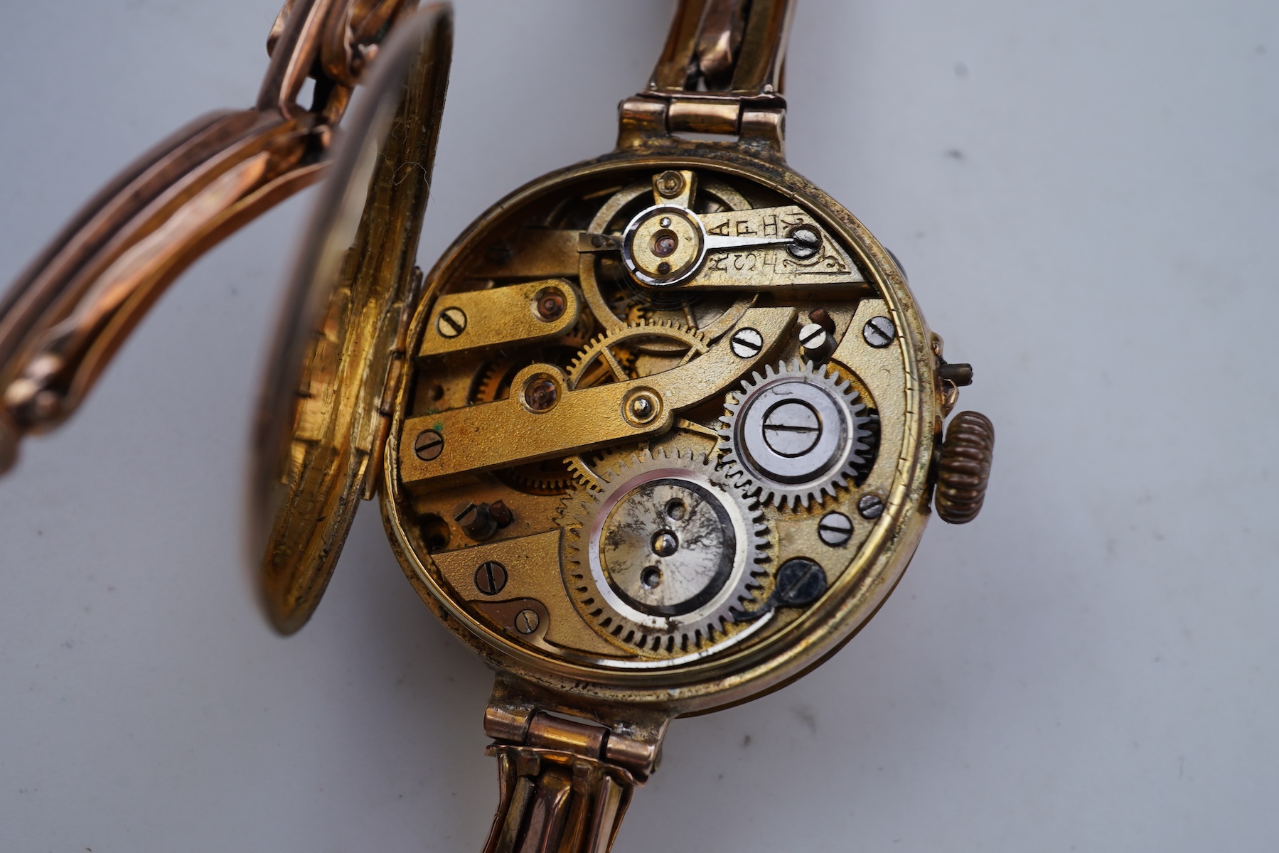Two gold bracelets and a gold watch